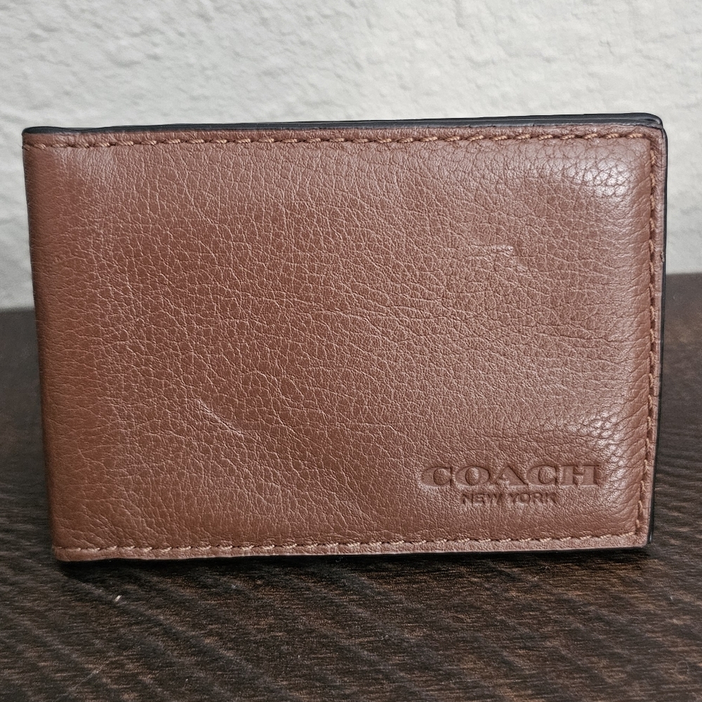 Brown leather coach card case